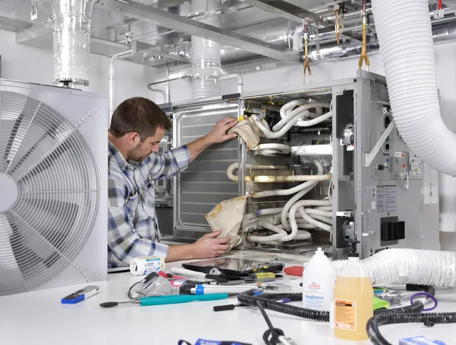 Seekonk Air Duct Cleaning specialist performing precision AC coil cleaning in Seekonk