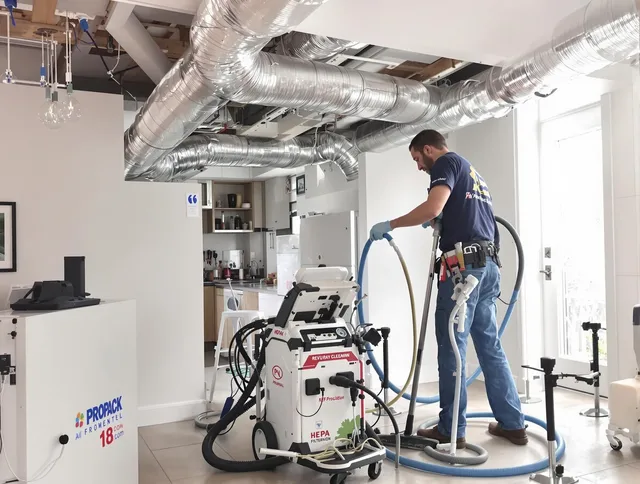 Seekonk Air Duct Cleaning technician performing advanced pure duct cleaning with specialized equipment in Seekonk