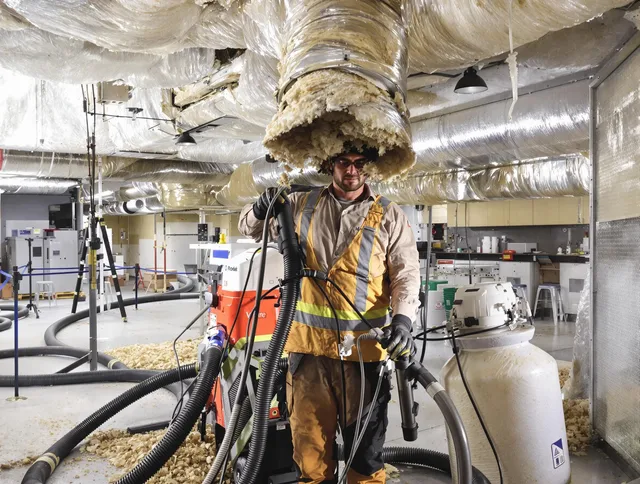 Professional vacuum insulation removal by Seekonk Air Duct Cleaning expert in Seekonk